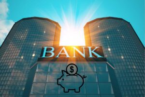 Una foto fi una banca e con sotto un salvadanaio a forma di maialino